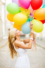 Image showing woman with colorful balloons