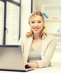 Image showing happy woman with laptop computer