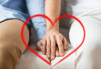 Image showing close up of happy male gay couple holding hands