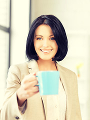 Image showing lovely businesswoman with mug