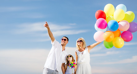 Image showing family with colorful balloons