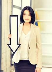 Image showing businesswoman with direction arrow sign