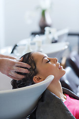 Image showing happy young woman at hair salon