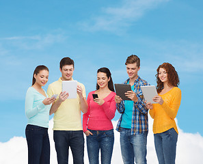 Image showing group of teenagers with smartphones and tablet pc