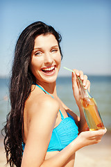 Image showing girl with bottle of drink on the beach