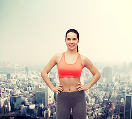 Image showing smiling teenage girl in sportswear