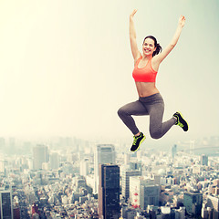 Image showing sporty teenage girl jumping in sportswear