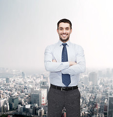 Image showing handsome businessman with crossed arms