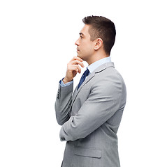 Image showing thinking businessman in suit making decision