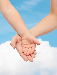 Image showing close up of woman and little child hands together