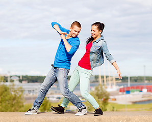 Image showing couple of teenagers dancing outside
