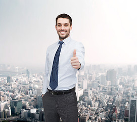 Image showing handsome businessman showing thumbs up