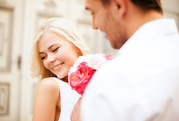 Image showing couple with flowers in the city