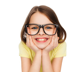 Image showing smiling cute little girl in black eyeglasses