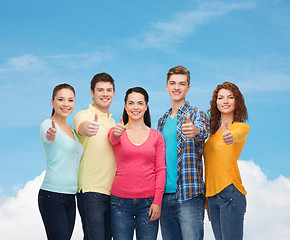 Image showing group of smiling teenagers showing thumbs up