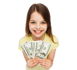 Image showing smiling little girl with dollar cash money