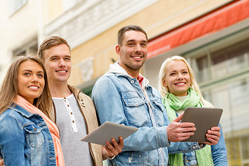 Image showing group of smiling friends with tablet pc computers