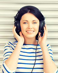 Image showing happy teenage girl in big headphones