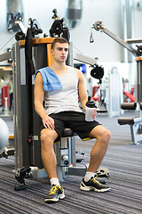 Image showing man exercising on gym machine