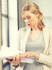 Image showing calm woman with documents