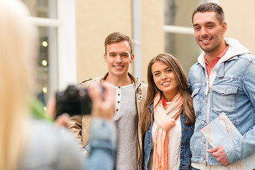 Image showing group of smiling friends taking photo outdoors