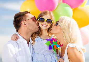 Image showing family with colorful balloons