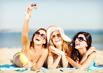 Image showing girls taking self photo on the beach