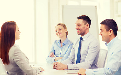 Image showing smiling businesswoman at interview in office