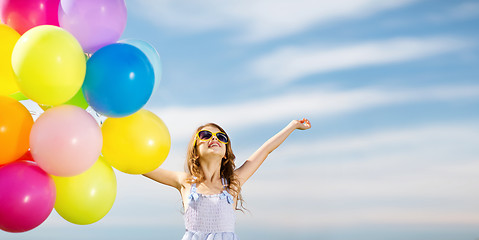 Image showing happy girl with colorful balloons