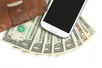 Image showing cellphone and money on white