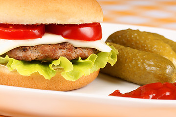 Image showing Mini cheese burger and pickles