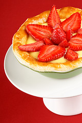 Image showing Strawberry and custard tart on a cakestand