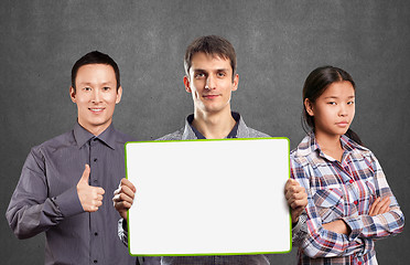 Image showing Asian team and male with write board in his hands