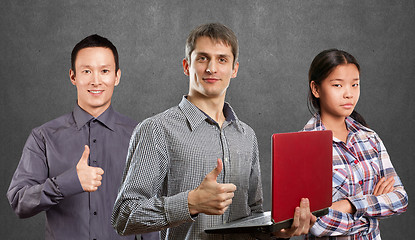 Image showing Asian team and man with laptop in his hands and woman