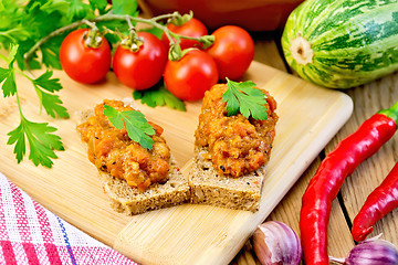 Image showing Sandwich with caviar squash and red pepper on board