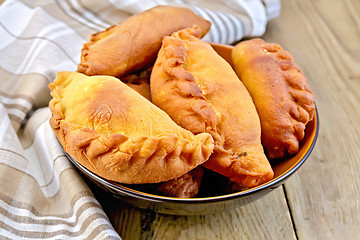 Image showing Patties fried in bowl with napkin on board