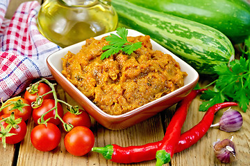 Image showing Caviar squash with tomatoes and peppers on board