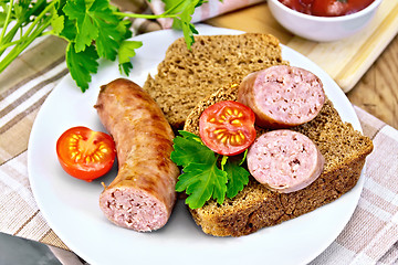 Image showing Sausages fried with bread and tomato in plate