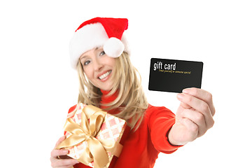 Image showing Woman holding gift card, credit card etc