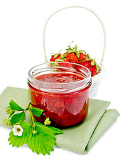 Image showing Jam strawberry with basket of berry on napkin