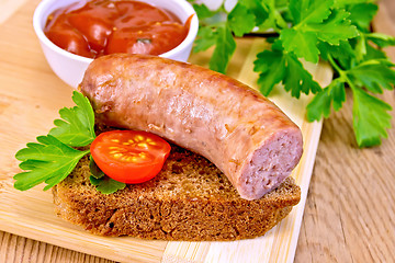 Image showing Sausages fried on bread with tomato