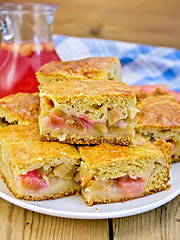 Image showing Pie rhubarb in plate and juice on board