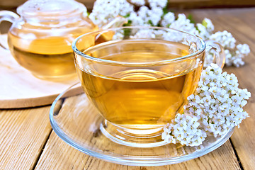 Image showing Tea with yarrow in cup on board