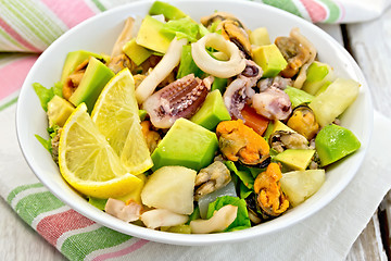 Image showing Salad seafood and avocado on linen napkin