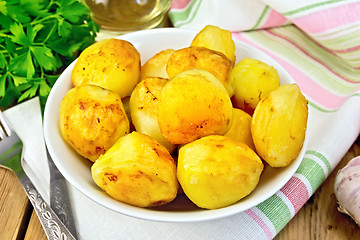 Image showing Potatoes fried in plate on fabric