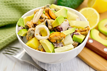 Image showing Salad seafood and avocado in bowl on board