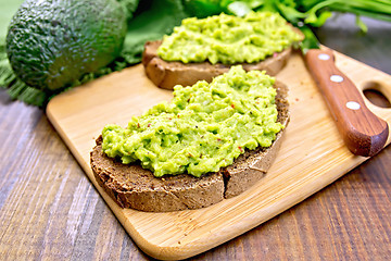 Image showing Sandwich with avocado guacamole on board