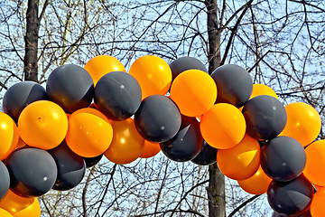 Image showing Balloons black and orange with sky