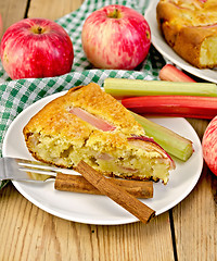 Image showing Pie with apple and rhubarb in plate on board