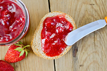 Image showing Bread with strawberry jam and berries on board